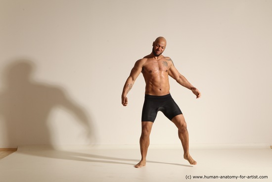 Underwear Gymnastic poses Man Black Muscular Bald Dancing Dynamic poses Academic