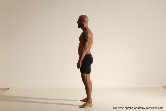 Underwear Gymnastic poses Man Black Muscular Bald Dancing Dynamic poses Academic