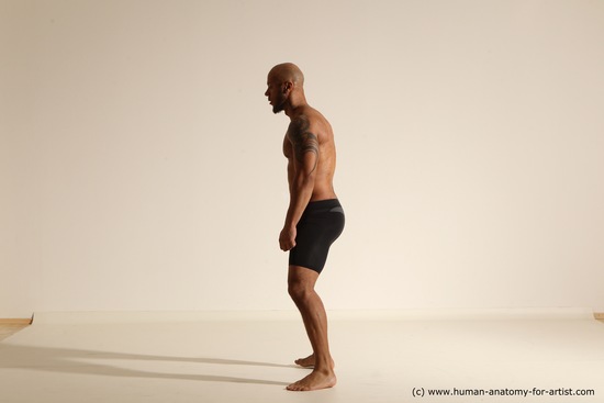 Underwear Gymnastic poses Man Black Muscular Bald Dancing Dynamic poses Academic