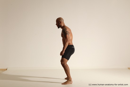 Underwear Gymnastic poses Man Black Muscular Bald Dancing Dynamic poses Academic