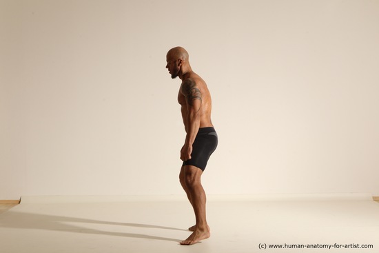 Underwear Gymnastic poses Man Black Muscular Bald Dancing Dynamic poses Academic