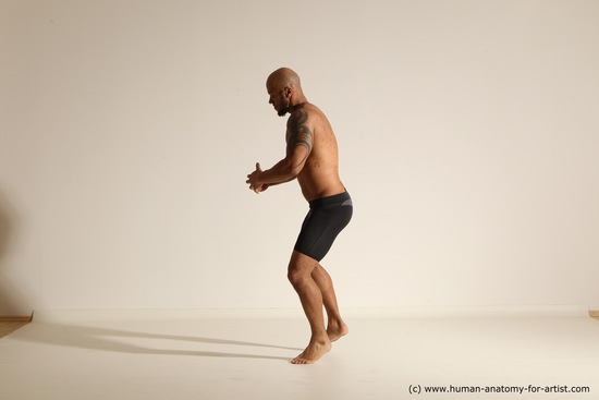 Underwear Gymnastic poses Man Black Muscular Bald Dancing Dynamic poses Academic