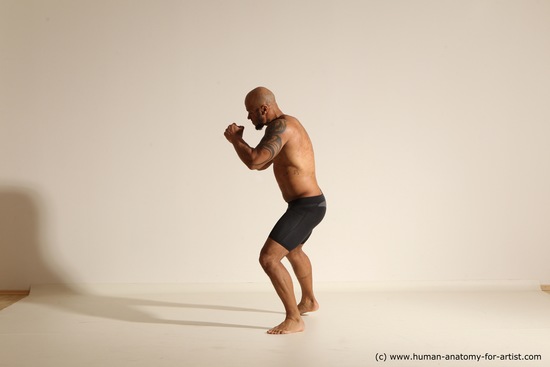 Underwear Gymnastic poses Man Black Muscular Bald Dancing Dynamic poses Academic