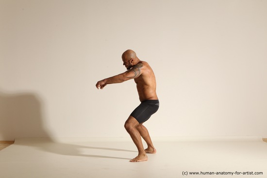 Underwear Gymnastic poses Man Black Muscular Bald Dancing Dynamic poses Academic