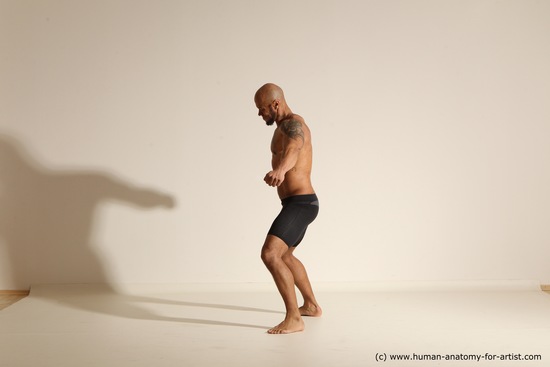 Underwear Gymnastic poses Man Black Muscular Bald Dancing Dynamic poses Academic