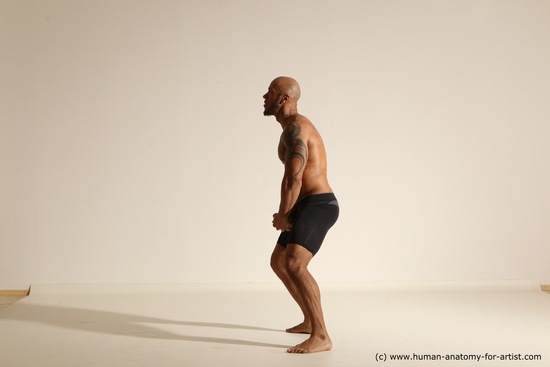 Underwear Gymnastic poses Man Black Muscular Bald Dancing Dynamic poses Academic