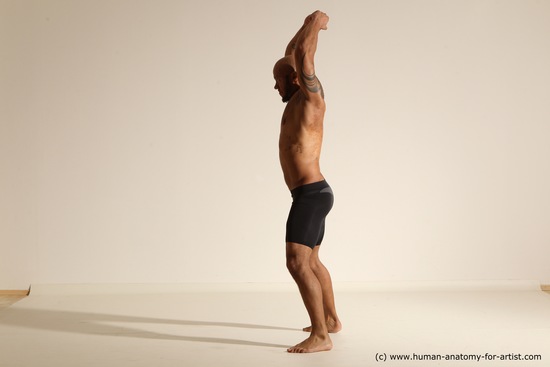 Underwear Gymnastic poses Man Black Muscular Bald Dancing Dynamic poses Academic