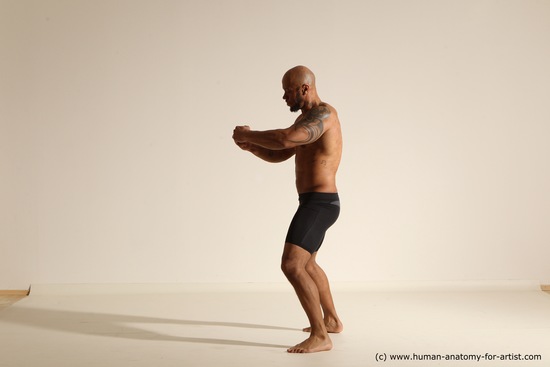 Underwear Gymnastic poses Man Black Muscular Bald Dancing Dynamic poses Academic