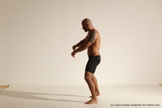 Underwear Gymnastic poses Man Black Muscular Bald Dancing Dynamic poses Academic