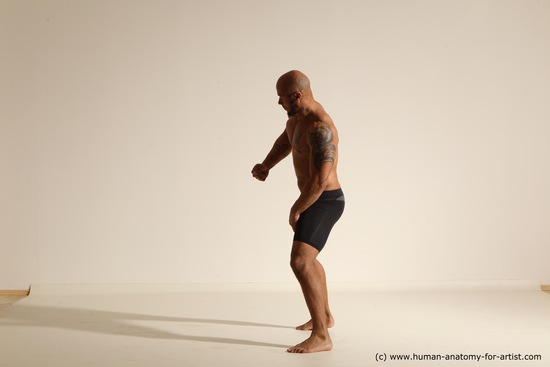 Underwear Gymnastic poses Man Black Muscular Bald Dancing Dynamic poses Academic