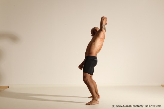 Underwear Gymnastic poses Man Black Muscular Bald Dancing Dynamic poses Academic