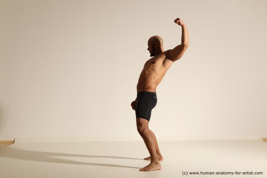 Underwear Gymnastic poses Man Black Muscular Bald Dancing Dynamic poses Academic