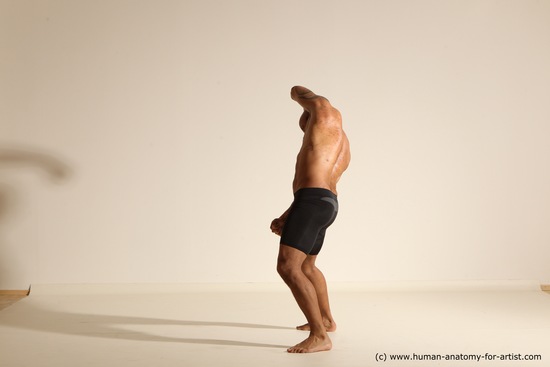 Underwear Gymnastic poses Man Black Muscular Bald Dancing Dynamic poses Academic