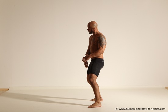 Underwear Gymnastic poses Man Black Muscular Bald Dancing Dynamic poses Academic