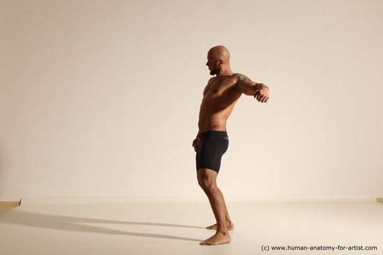 Underwear Gymnastic poses Man Black Muscular Bald Dancing Dynamic poses Academic