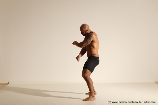 Underwear Gymnastic poses Man Black Muscular Bald Dancing Dynamic poses Academic