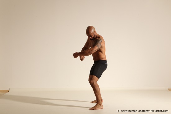 Underwear Gymnastic poses Man Black Muscular Bald Dancing Dynamic poses Academic