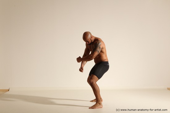 Underwear Gymnastic poses Man Black Muscular Bald Dancing Dynamic poses Academic