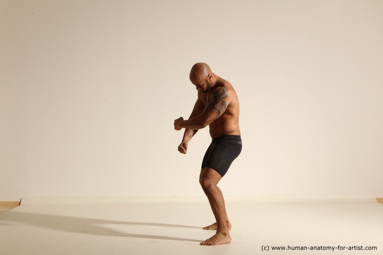 Underwear Gymnastic poses Man Black Muscular Bald Dancing Dynamic poses Academic