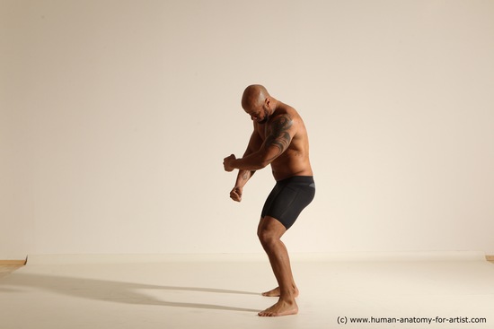 Underwear Gymnastic poses Man Black Muscular Bald Dancing Dynamic poses Academic