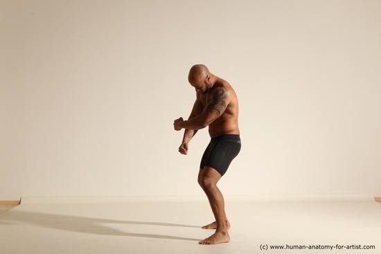 Underwear Gymnastic poses Man Black Muscular Bald Dancing Dynamic poses Academic