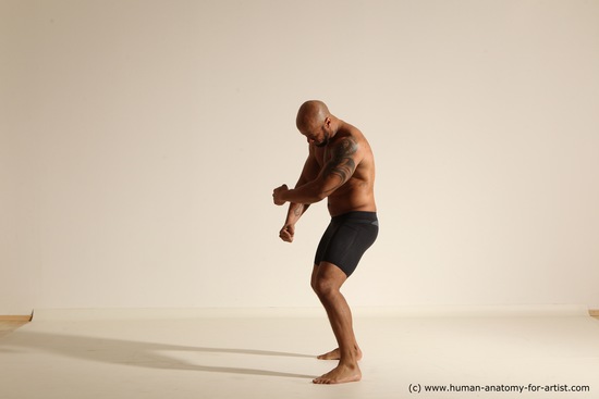 Underwear Gymnastic poses Man Black Muscular Bald Dancing Dynamic poses Academic