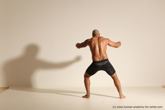 Underwear Gymnastic poses Man Black Muscular Bald Dancing Dynamic poses Academic