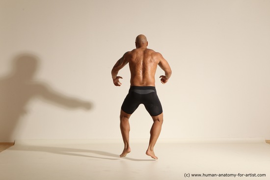 Underwear Gymnastic poses Man Black Muscular Bald Dancing Dynamic poses Academic