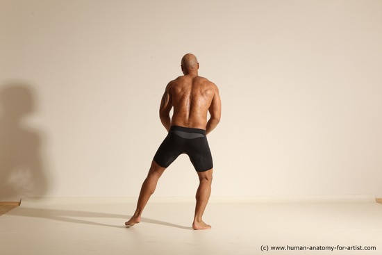 Underwear Gymnastic poses Man Black Muscular Bald Dancing Dynamic poses Academic