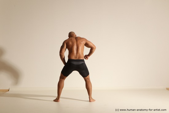 Underwear Gymnastic poses Man Black Muscular Bald Dancing Dynamic poses Academic