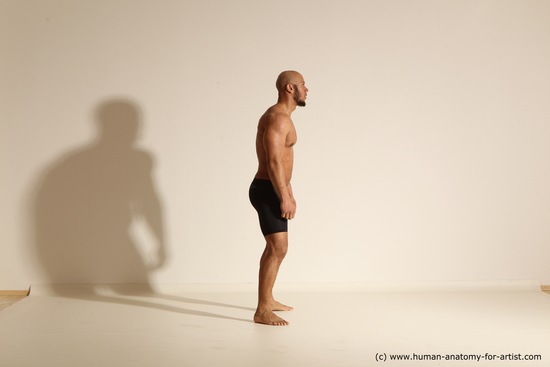 Underwear Gymnastic poses Man Black Muscular Bald Dancing Dynamic poses Academic