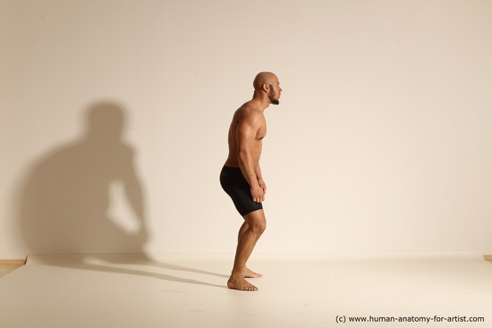 Underwear Gymnastic poses Man Black Muscular Bald Dancing Dynamic poses Academic