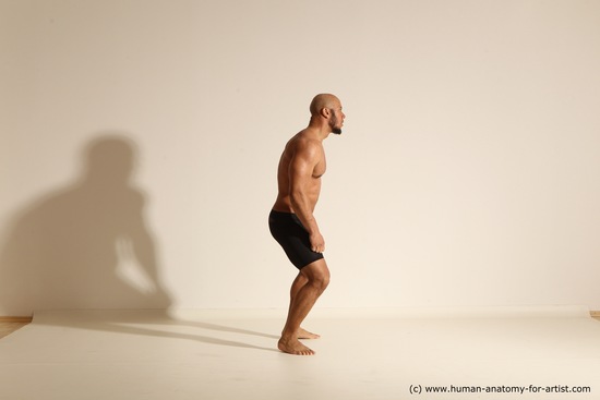 Underwear Gymnastic poses Man Black Muscular Bald Dancing Dynamic poses Academic