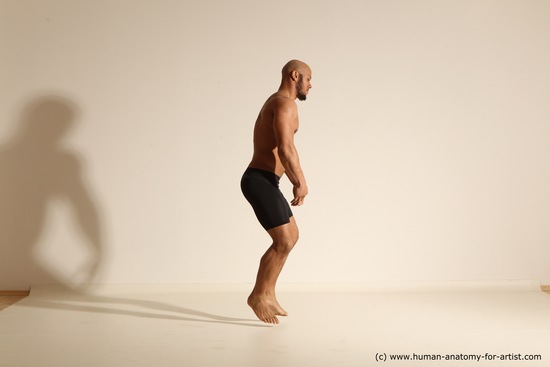 Underwear Gymnastic poses Man Black Muscular Bald Dancing Dynamic poses Academic