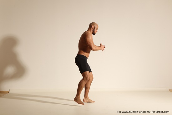 Underwear Gymnastic poses Man Black Muscular Bald Dancing Dynamic poses Academic