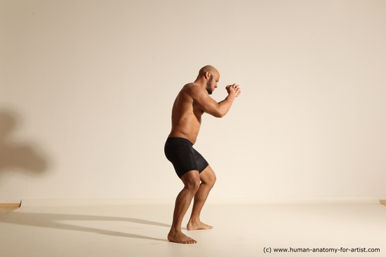 Underwear Gymnastic poses Man Black Muscular Bald Dancing Dynamic poses Academic