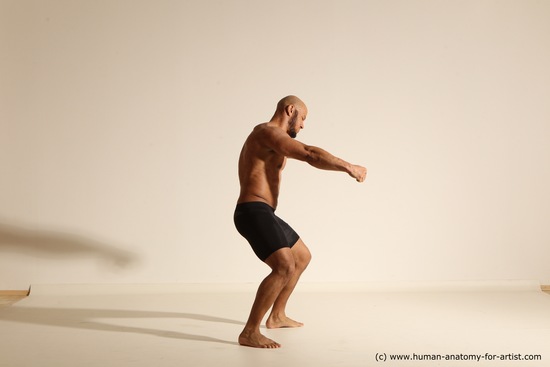 Underwear Gymnastic poses Man Black Muscular Bald Dancing Dynamic poses Academic