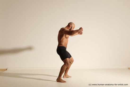 Underwear Gymnastic poses Man Black Muscular Bald Dancing Dynamic poses Academic