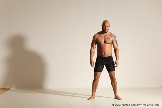 Underwear Gymnastic poses Man Black Muscular Bald Dancing Dynamic poses Academic