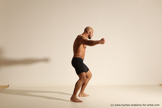 Underwear Gymnastic poses Man Black Muscular Bald Dancing Dynamic poses Academic