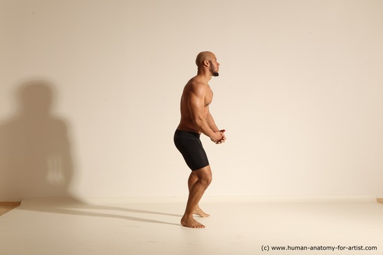 Underwear Gymnastic poses Man Black Muscular Bald Dancing Dynamic poses Academic