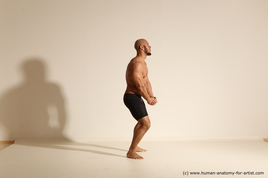 Underwear Gymnastic poses Man Black Muscular Bald Dancing Dynamic poses Academic