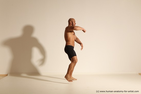 Underwear Gymnastic poses Man Black Muscular Bald Dancing Dynamic poses Academic