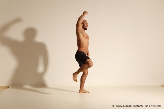 Underwear Gymnastic poses Man Black Muscular Bald Dancing Dynamic poses Academic