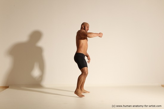 Underwear Gymnastic poses Man Black Muscular Bald Dancing Dynamic poses Academic