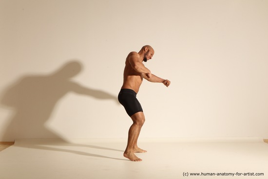 Underwear Gymnastic poses Man Black Muscular Bald Dancing Dynamic poses Academic