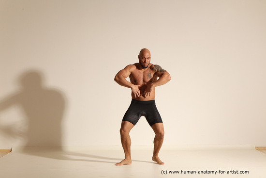 Underwear Gymnastic poses Man Black Muscular Bald Dancing Dynamic poses Academic