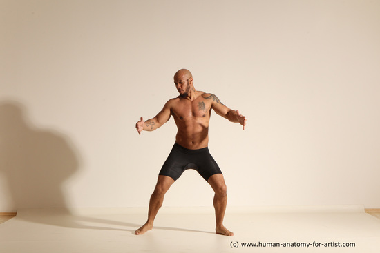 Underwear Gymnastic poses Man Black Muscular Bald Dancing Dynamic poses Academic