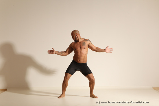 Underwear Gymnastic poses Man Black Muscular Bald Dancing Dynamic poses Academic