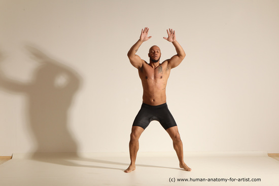 Underwear Gymnastic poses Man Black Muscular Bald Dancing Dynamic poses Academic